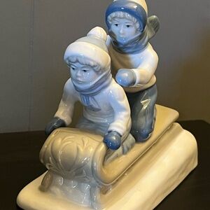 Porcelain Figurine of Children Sledding